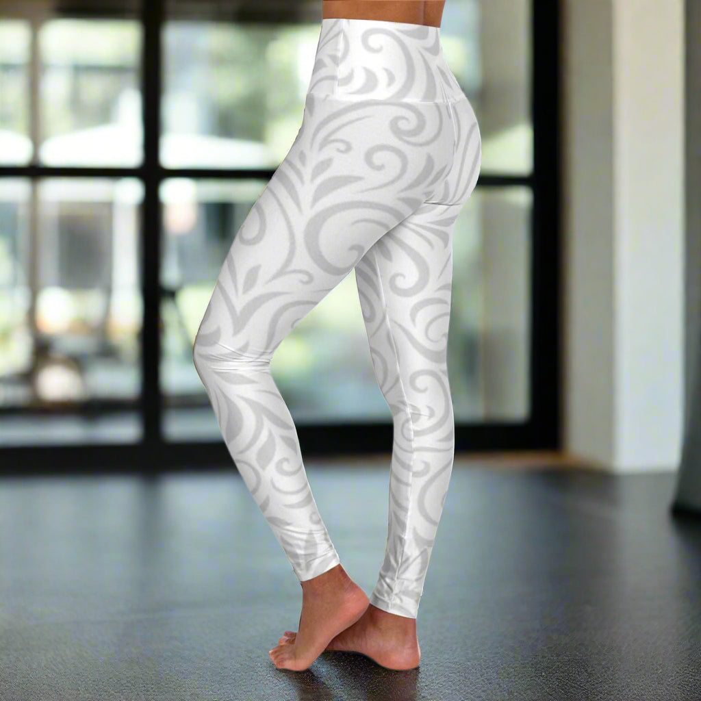 White leggings with gray pattern worn by a person on a white background