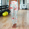 High waisted yoga leggings with pink flamingo and tropical print, lightweight and stretchy athletic wear for workouts.