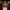 Woman wearing a purple Precision Gym Sports Bra and white leggings in gym workout setting