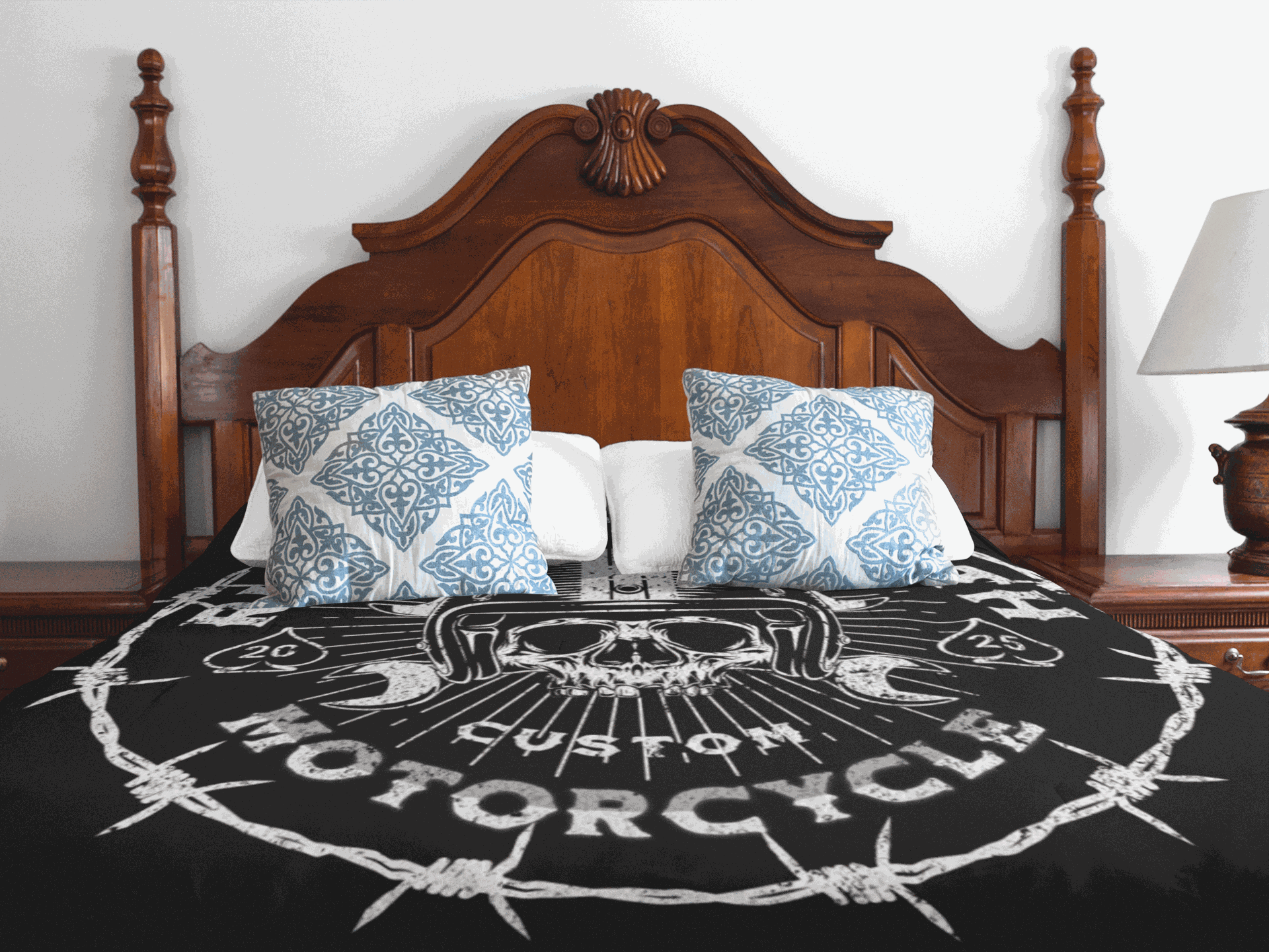 Black Ride till death velveteen plush blanket with skull and motorcycle design on a bed with wooden headboard